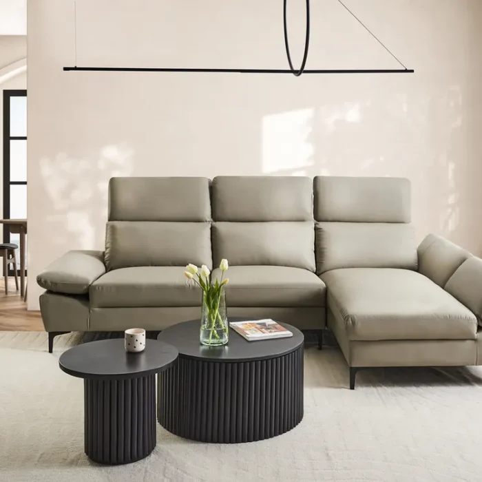 "Modern comfort: a sleek, light gray sectional sofa invites relaxation in this serene living room."